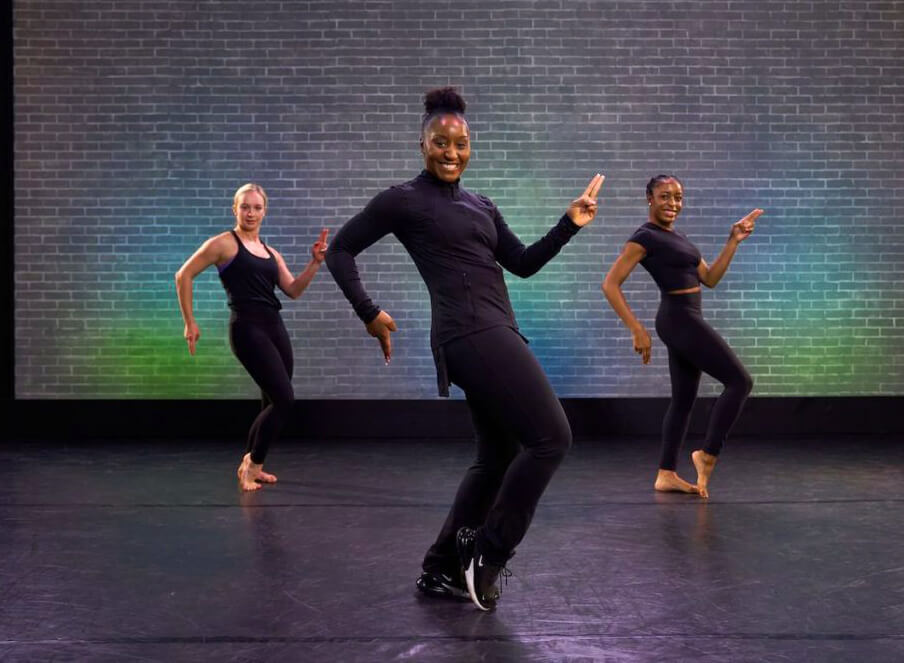 Professional jazz dancers performing dynamic dance at luxury event